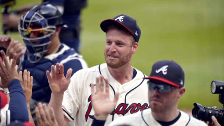 ATLANTA, GA - JUNE 06: Will Smith #51 and Freddie Freeman #5 of the Atlanta Braves leave the field after beating the Los Angeles Dodgers 4-2 at Truist Park on June 6, 2021 in Atlanta, Georgia. (Photo by Edward M. Pio Roda/Getty Images)