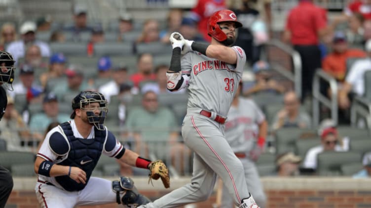 ATLANTA, GA - AUGUST 12: Jesse Winker #33 of the Cincinnati Reds hits a grand slam in the second inning against the Atlanta Braves at Truist Park on August 12, 2021 in Atlanta, Georgia. (Photo by Edward M. Pio Roda/Getty Images)