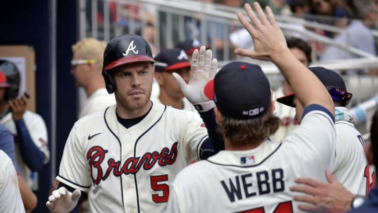 ATLANTA, GA - SEPTEMBER 12: Freddie Freeman #5 of the Atlanta Braves celebrates with Jacob Webb #71 after hitting a home run in the seventh inning against the Miami Marlins at Truist Park on September 12, 2021 in Atlanta, Georgia. (Photo by Edward M. Pio Roda/Getty Images)