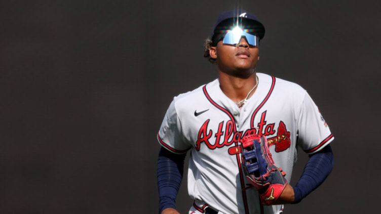 WASHINGTON, DC - APRIL 07: Cristian Pache #25 of the Atlanta Braves runs off of the field after the first inning against the Washington Nationals in game two of a doubleheader at Nationals Park on April 7, 2021 in Washington, DC. (Photo by Patrick Smith/Getty Images)