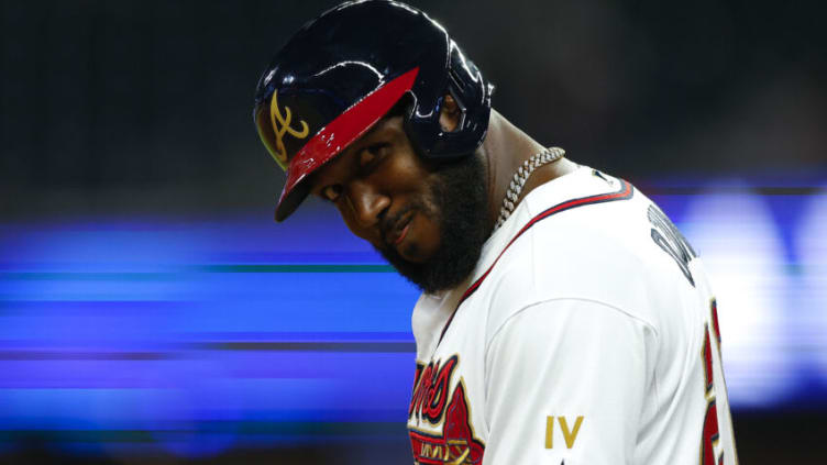Marcell Ozuna of the Atlanta Braves looks back to the dugout... for some offensive support? (Photo by Todd Kirkland/Getty Images)