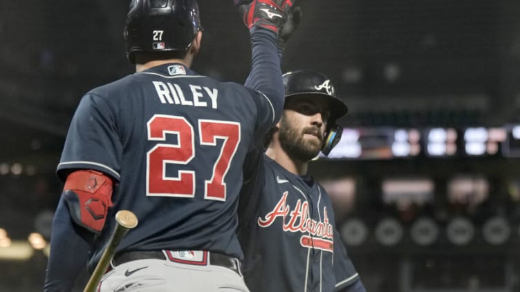 Dansby Swanson #7 of the Atlanta Braves is congratulated by Austin Riley #27 after Swanson hit a two-run home run against the San Francisco Giants. (Photo by Thearon W. Henderson/Getty Images)