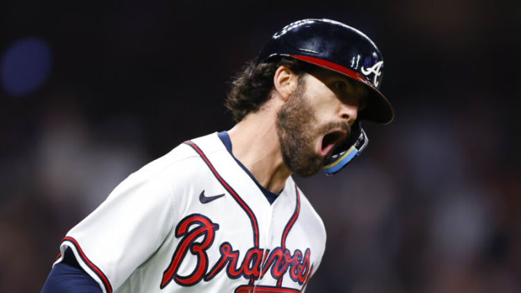 ATLANTA, GA - OCTOBER 01: Dansby Swanson #7 of the Atlanta Braves reacts after hitting a two run home run during the fifth inning against the New York Mets at Truist Park on October 1, 2022 in Atlanta, Georgia. (Photo by Todd Kirkland/Getty Images)