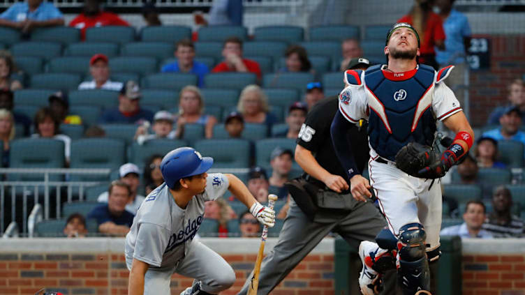 ATLANTA, GA - AUGUST 01: Tyler Flowers #25 of the Atlanta Braves jumps up to catch a bunt pop out in foul territory by Kenta Maeda #18 of the Los Angeles Dodgers in the third inning at SunTrust Park on August 1, 2017 in Atlanta, Georgia. (Photo by Kevin C. Cox/Getty Images)