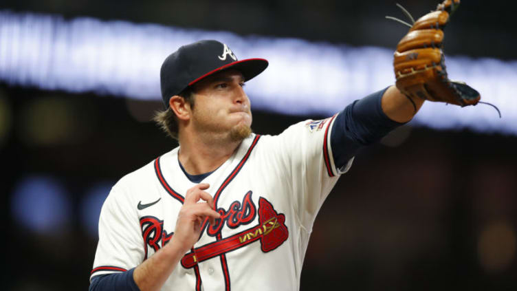 ATLANTA, GA - MAY 12: Luke Jackson #77 of the Atlanta Braves covers first base in the seventh inning against the Toronto Blue Jays at Truist Park on May 12, 2021 in Atlanta, Georgia. (Photo by Todd Kirkland/Getty Images)