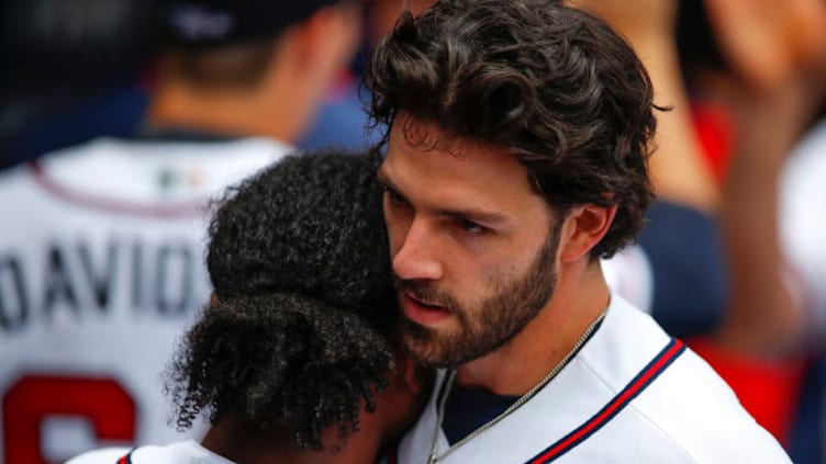 ATLANTA, GA - JUNE 03: Dansby Swanson #7 reacts with Ozzie Albies #1 of the Atlanta Braves after a two run home run in the sixth inning of an MLB game against the Washington Nationals at Truist Park on June 3, 2021 in Atlanta, Georgia. (Photo by Todd Kirkland/Getty Images)