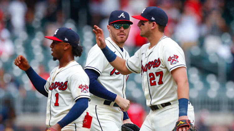 Atlanta Braves infielders Ozzie Albies, Freddie Freeman and Austin Riley of the Atlanta Braves celebrate a victory. (Photo by Todd Kirkland/Getty Images)