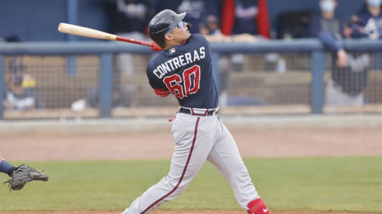 PORT CHARLOTTE, FLORIDA - MARCH 21: William Contreras #60 of the Atlanta Braves in action against the Tampa Bay Rays during a Grapefruit League spring training game at Charlotte Sports Park on March 21, 2021 in Port Charlotte, Florida. (Photo by Michael Reaves/Getty Images)