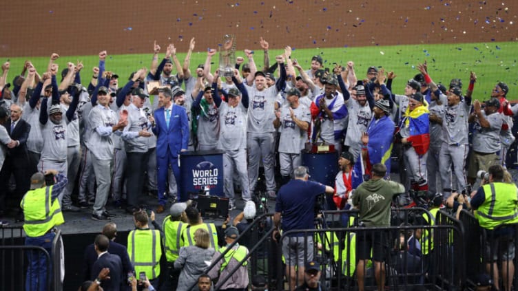 HOUSTON, TEXAS - NOVEMBER 02: Manager Brian Snitker #43 of the Atlanta Braves hoists the commissioner's trophy following the team's 7-0 victory against the Houston Astros in Game Six to win the 2021 World Series at Minute Maid Park on November 02, 2021 in Houston, Texas. (Photo by Bob Levey/Getty Images)