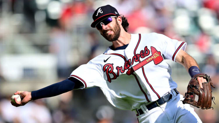 ATLANTA, GEORGIA - OCTOBER 11: Dansby Swanson #7 of the Atlanta Braves throws for an out against the Philadelphia Phillies during the seventh inning in game one of the National League Division Series at Truist Park on October 11, 2022 in Atlanta, Georgia. (Photo by Adam Hagy/Getty Images)