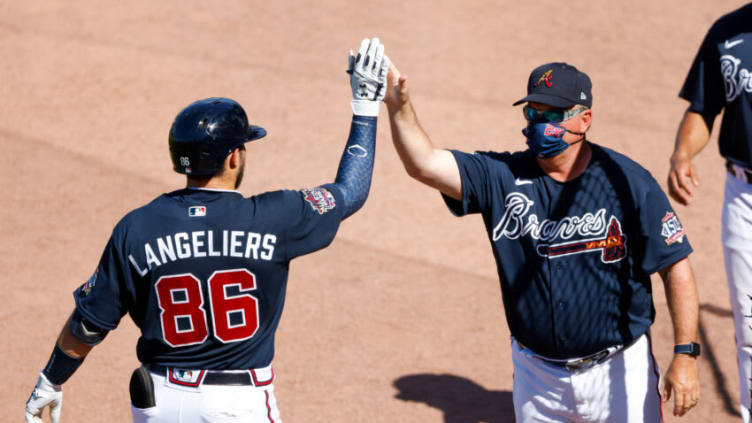 Mississippi / Atlanta Braves catcher Shea Langeliers (86) is greeted by hitting coach Kevin Seitzer during a Spring game. Mandatory Credit: Nathan Ray Seebeck-USA TODAY Sports