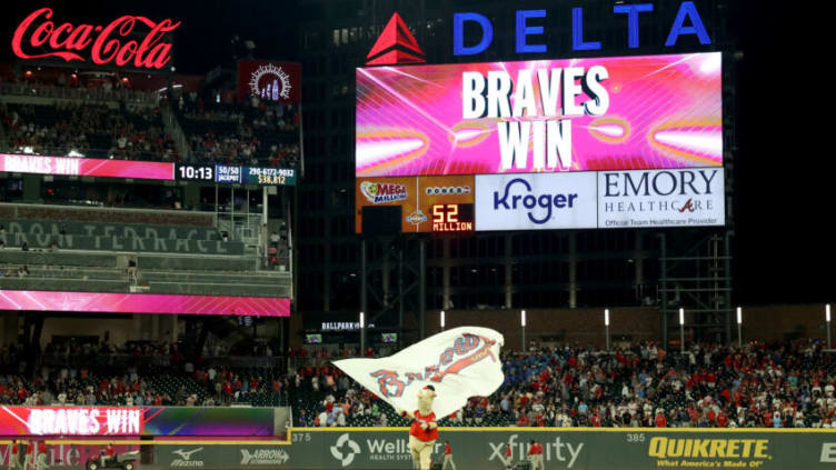 Blooper waves a Braves flag after a Atlanta Braves win. Mandatory Credit: Jason Getz-USA TODAY Sports
