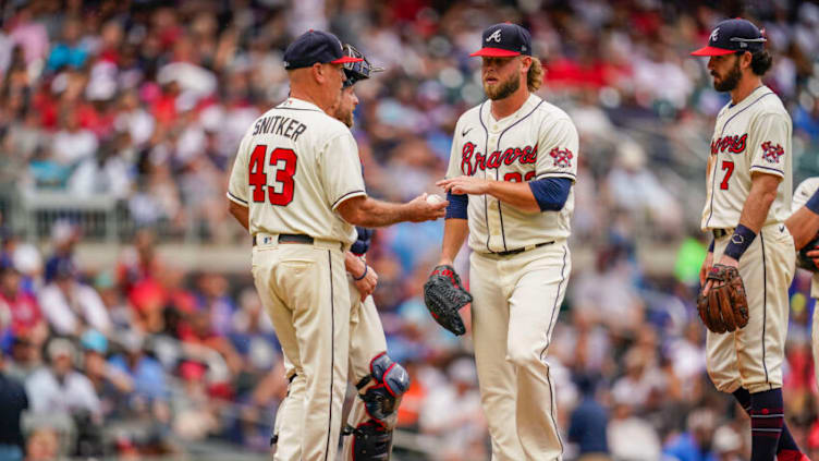 Atlanta Braves manager Brian Snitker (43) takes the ball from relief pitcher A.J. Minter. Mandatory Credit: Dale Zanine-USA TODAY Sports