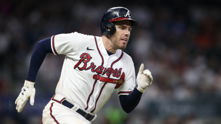 Atlanta Braves first baseman Freddie Freeman (5) hits a single against the New York Yankees. Mandatory Credit: Brett Davis-USA TODAY Sports