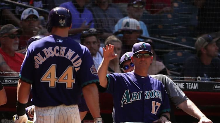 PHOENIX, AZ - MAY 03: Manager Torey Lovullo #17 of the Arizona Diamondbacks high fives Paul Goldschmidt #44 after scoring against the Los Angeles Dodgers during the sixth inning of the MLB game at Chase Field on May 3, 2018 in Phoenix, Arizona. The Dodgers defeated the Diamondbacks 5-2. (Photo by Christian Petersen/Getty Images)