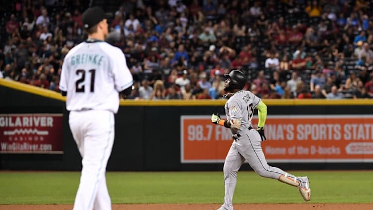 PHOENIX, AZ - SEPTEMBER 22: Marcell Ozuna #13 of the Miami Marlins rounds the bases after hitting a solo home run off of Zack Greinke #21 of the Arizona Diamondbacks during the fourth inning at Chase Field on September 22, 2017 in Phoenix, Arizona. It was Ozunas second home run of the game. (Photo by Norm Hall/Getty Images)