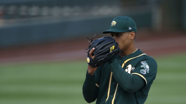 SCOTTSDALE, ARIZONA - MARCH 16: Starting pitcher Jesus Luzardo #44 of the Oakland Athletics looks in for a sign as he prepares to throw against the Arizona Diamondbacks during the first inning of the MLB spring training baseball game at Salt River Fields at Talking Stick on March 16, 2021 in Scottsdale, Arizona. (Photo by Ralph Freso/Getty Images)