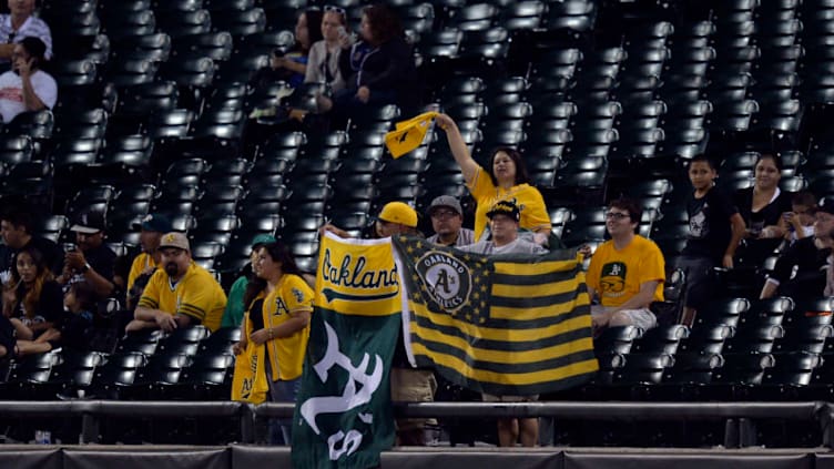 CHICAGO, IL - SEPTEMBER 8: Oakland Athletics fans cheer during the twelfth inning against the Chicago White Sox at U.S. Cellular Field on September 8, 2014 in Chicago, Illinois. The White Sox defeated the Athletics 5-4 in 12 innings. (Photo by Brian D. Kersey/Getty Images)