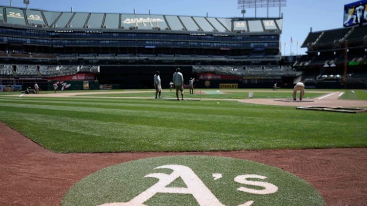 Jun 14, 2018; Oakland, CA, USA; General view of the field maintenance crew for the Oakland Athletics before the game against the Houston Astros at the Oakland Coliseum. Mandatory Credit: Stan Szeto-USA TODAY Sports