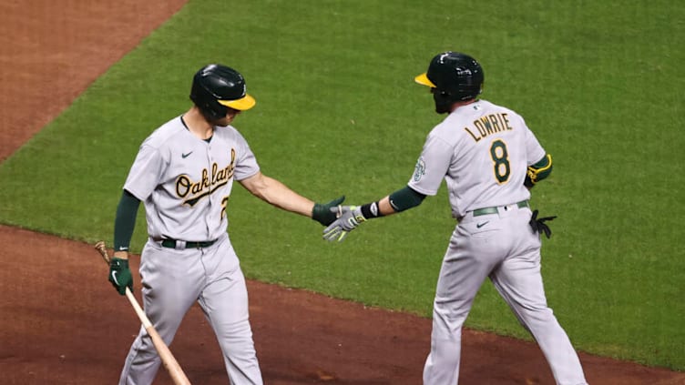 Apr 9, 2021; Houston, Texas, USA; Oakland Athletics second baseman Jed Lowrie (8) celebrates with first baseman Matt Olson (28) after hitting a home run during the fourth inning against the Houston Astros at Minute Maid Park. Mandatory Credit: Troy Taormina-USA TODAY Sports