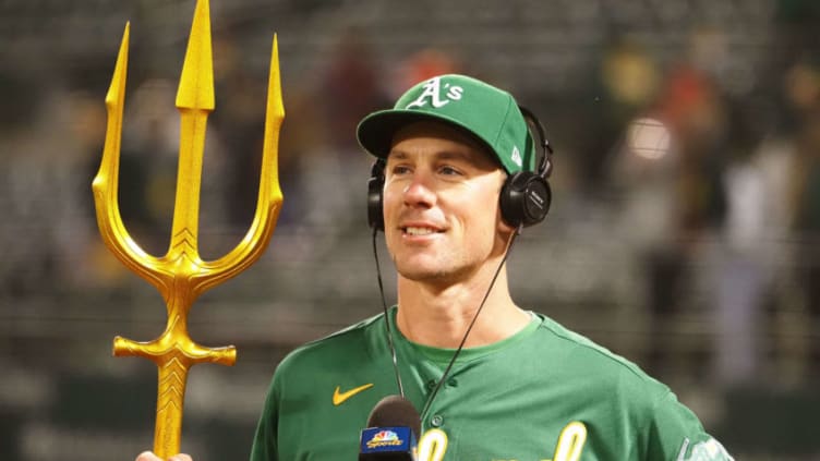 May 27, 2021; Oakland, California, USA; Oakland Athletics starting pitcher Chris Bassitt (40) smiles with a triton for the Athletics “ride the wave” motto during a post-game interview after pitching a complete game shut out against the Los Angeles Angels at RingCentral Coliseum. Mandatory Credit: Kelley L Cox-USA TODAY Sports