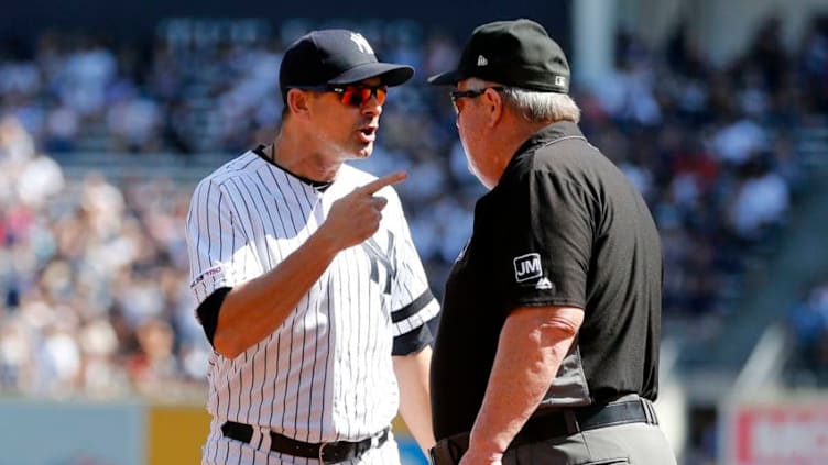 NEW YORK, NEW YORK - SEPTEMBER 21: Manager Aaron Boone #17 of the New York Yankees argues with umpire crew chief Joe West after he was ejected from a game against the Toronto Blue Jays between the first and second innings at Yankee Stadium on September 21, 2019 in the Bronx borough of New York City. (Photo by Jim McIsaac/Getty Images)