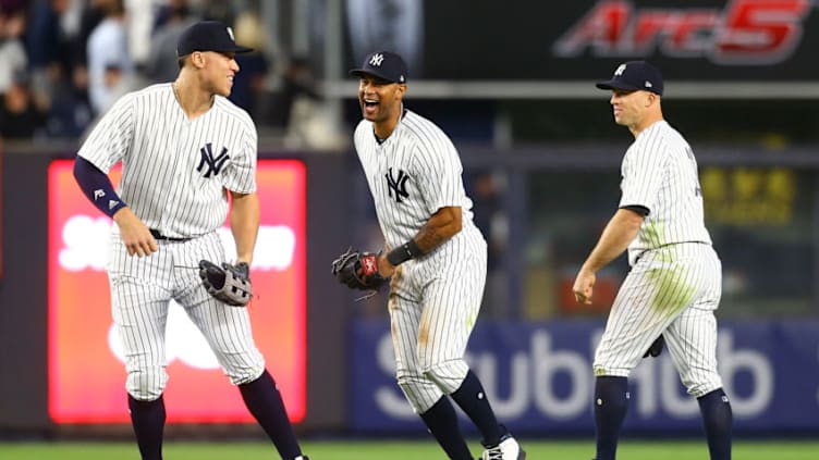 NEW YORK, NY - MAY 08: Aaron Judge #99, Aaron Hicks #31 and Brett Gardner #11 of the New York Yankees celebrate after defeating the Boston Red Sox 3-2 at Yankee Stadium on May 8, 2018 in the Bronx borough of New York City. (Photo by Mike Stobe/Getty Images)