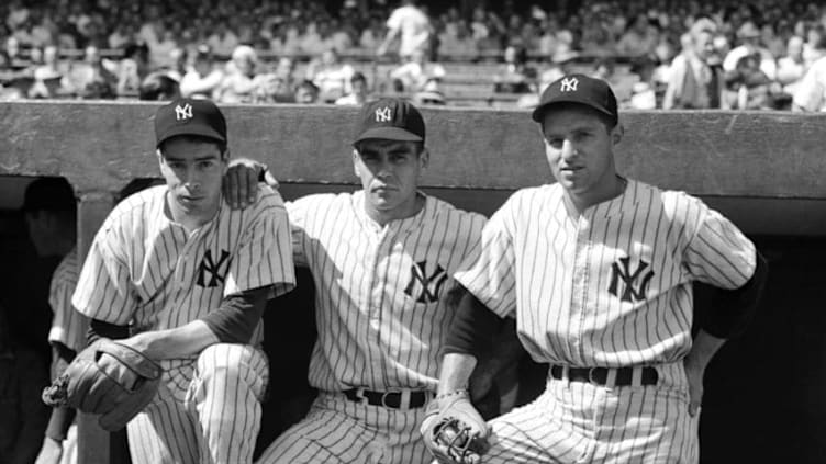 BRONX, NY - 1941: (l to r) Outfielders Joe DiMaggio, Charlie Keller and Tom Henrich of the New York Yankees pose for a portrait on the dugout steps prior to a 1941 season game at Yankee Stadium in the Bronx, New York. (Photo by Kidwiler Collection/Diamond Images/Getty Images)