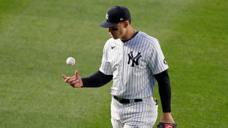 NEW YORK, NEW YORK - APRIL 21: (NEW YORK DAILIES OUT) Aaron Judge #99 of the New York Yankees warms up between innings against the Atlanta Braves at Yankee Stadium on April 21, 2021 in New York City. The Braves defeated the Yankees 4-1. (Photo by Jim McIsaac/Getty Images)