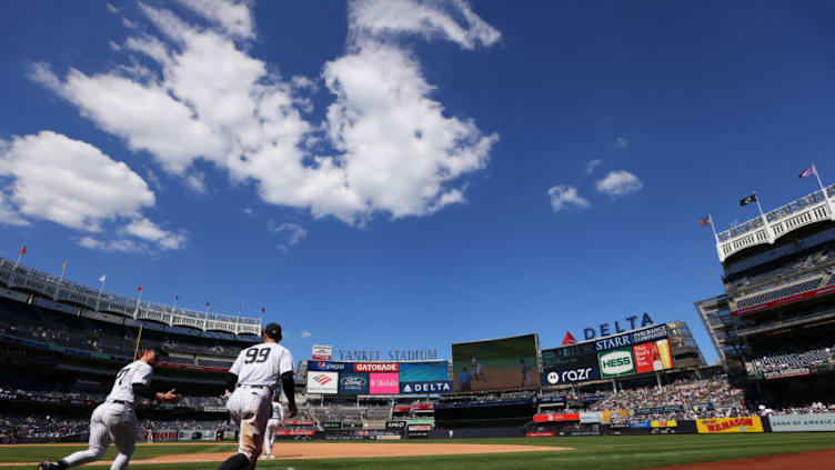 NEW YORK, NY - JUNE 24: Clint Frazier #77 and Aaron Judge #99 of the New York Yankees run onto the field during the eighth inning of a game against the Kansas City Royals at Yankee Stadium on June 24, 2021 in New York City. The Yankees defeated the Royals 8-1. (Photo by Rich Schultz/Getty Images)