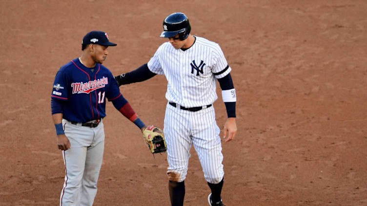 NEW YORK, NEW YORK - OCTOBER 05: Aaron Judge #99 of the New York Yankees and Jorge Polanco #11 of the Minnesota Twins talk during game two of the American League Divisional Series at Yankee Stadium on October 04, 2019 in the Bronx borough of New York City. (Photo by Emilee Chinn/Getty Images)