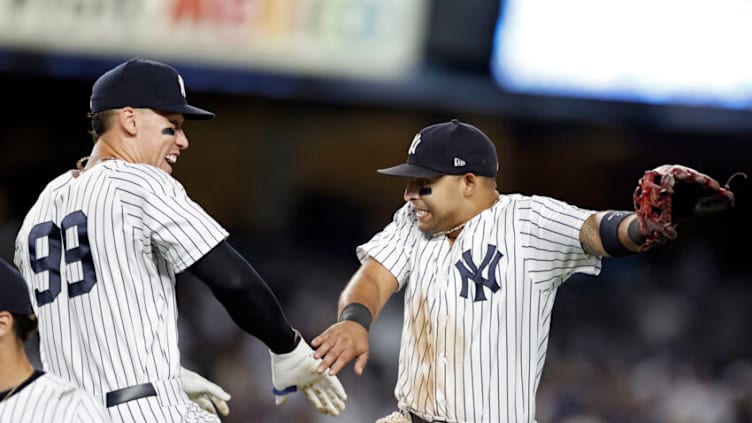 NEW YORK, NY - AUGUST 17: Aaron Judge #99 of the New York Yankees and Rougned Odor #12 of the New York Yankees celebrate after the Yankees defeated the Boston Red Sox in game two of a doubleheader at Yankee Stadium on August 17, 2021 in New York City. The Yankees won 2-0. (Photo by Adam Hunger/Getty Images)