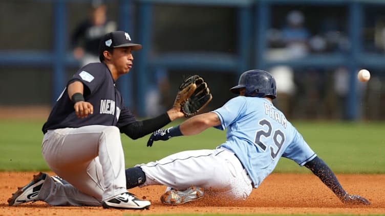 PORT CHARLOTTE, FLORIDA - FEBRUARY 24: Tommy Pham #29 of the Tampa Bay Rays safely steals second base past Oswaldo Cabrera #98 of the New York Yankees during the Grapefruit League spring training game at Charlotte Sports Park on February 24, 2019 in Port Charlotte, Florida. (Photo by Michael Reaves/Getty Images)