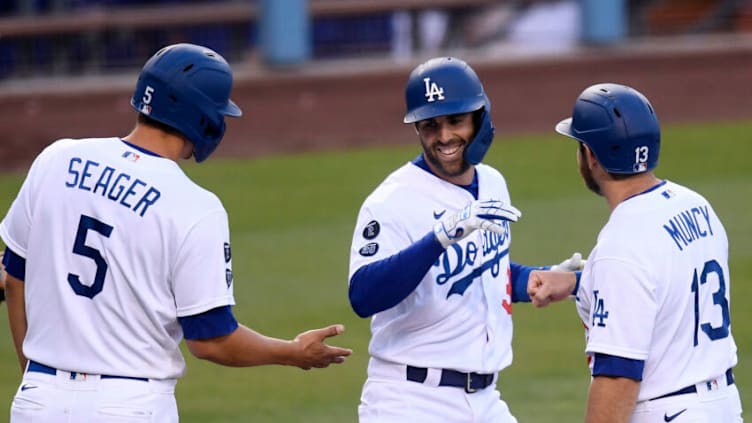 LOS ANGELES, CALIFORNIA - APRIL 25: Chris Taylor #3 of the Los Angeles Dodgers celebrates his three run homerun with Corey Seager #5 and Max Muncy #13, to take a 7-1 lead over the San Diego Padres during the sixth inning at Dodger Stadium on April 25, 2021 in Los Angeles, California. (Photo by Harry How/Getty Images)