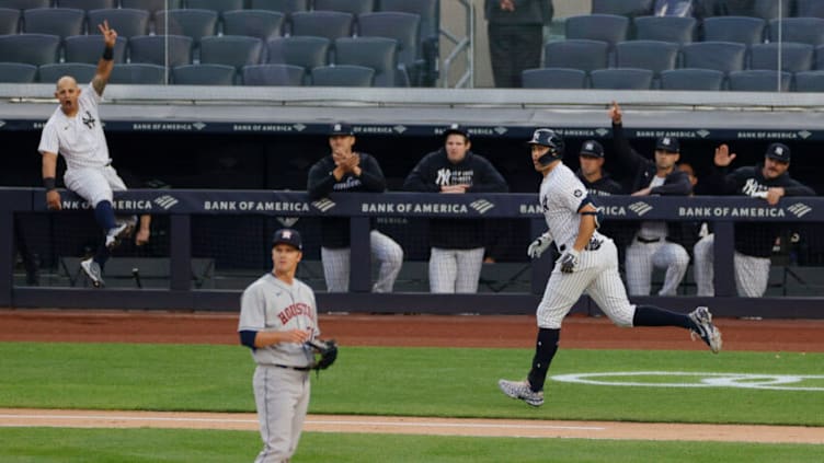 NEW YORK, NEW YORK - MAY 04: Giancarlo Stanton #27 of the New York Yankees reacts after hitting a two-run home run off of Zack Greinke #21 of the Houston Astros during the first inning at Yankee Stadium on May 04, 2021 in the Bronx borough of New York City. (Photo by Sarah Stier/Getty Images)