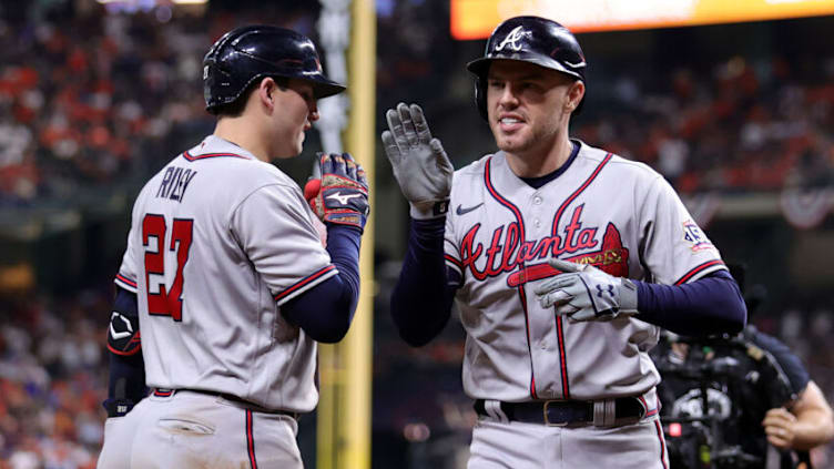 HOUSTON, TEXAS - NOVEMBER 02: Freddie Freeman #5 of the Atlanta Braves celebrates with Austin Riley #27 after hitting a solo home run against the Houston Astros during the seventh inning in Game Six of the World Series at Minute Maid Park on November 02, 2021 in Houston, Texas. (Photo by Carmen Mandato/Getty Images)