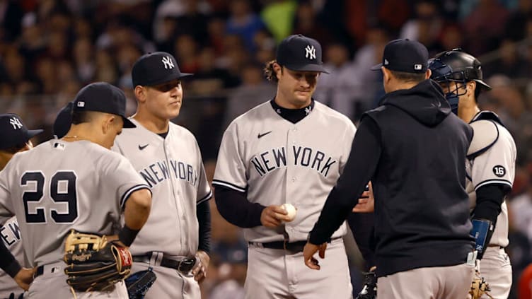 BOSTON, MASSACHUSETTS - OCTOBER 05: Manager Aaron Boone #17 takes out Gerrit Cole #45 of the New York Yankees against the Boston Red Sox during the third inning of the American League Wild Card game at Fenway Park on October 05, 2021 in Boston, Massachusetts. (Photo by Winslow Townson/Getty Images)