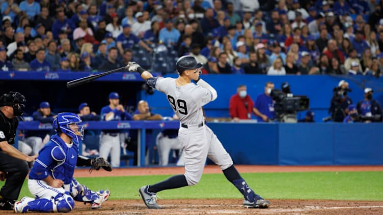 TORONTO, ON - MAY 03: Aaron Judge #99 of the New York Yankees hits an RBI double, batting in Aaron Hicks #31, in the seventh inning of their MLB game against the Toronto Blue Jays at Rogers Centre on May 3, 2022 in Toronto, Canada. (Photo by Cole Burston/Getty Images)