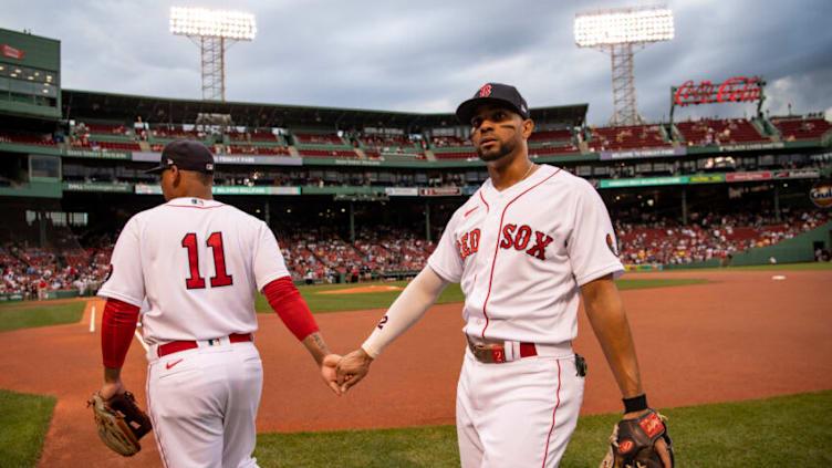 BOSTON, MA - AUGUST 9: Rafael Devers #11 reacts with Xander Bogaerts #22 of the Boston Red Sox before a game against the Atlanta Braves on August 9, 2022 at Fenway Park in Boston, Massachusetts. (Photo by Billie Weiss/Boston Red Sox/Getty Images)