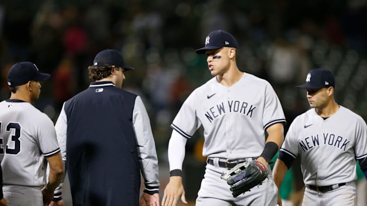 OAKLAND, CALIFORNIA - AUGUST 26: Aaron Judge #99 of the New York Yankees celebrates with teammates after a win against the Oakland Athletics at RingCentral Coliseum on August 26, 2022 in Oakland, California. (Photo by Lachlan Cunningham/Getty Images)