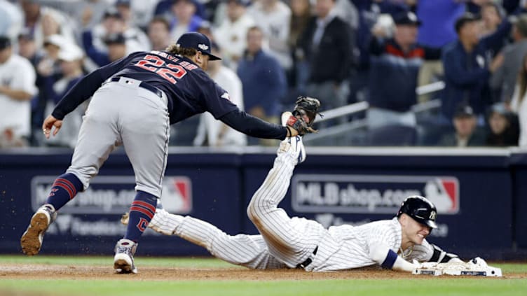 NEW YORK, NEW YORK - OCTOBER 11: Josh Donaldson #28 of the New York Yankees gets tagged out at first base by Josh Naylor #22 of the Cleveland Guardians during the fifth inning in game one of the American League Division Series at Yankee Stadium on October 11, 2022 in New York, New York. (Photo by Sarah Stier/Getty Images)