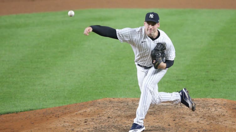 Aug 11, 2020; Bronx, New York, USA; New York Yankees relief pitcher Adam Ottavino (0) pitches against the Atlanta Braves during the seventh inning at Yankee Stadium. Mandatory Credit: Brad Penner-USA TODAY Sports