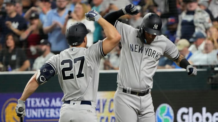 Oct 3, 2022; Arlington, Texas, USA; New York Yankees left fielder Marwin Gonzalez (14) celebrates his home run with designated hitter Giancarlo Stanton (27) against the Texas Rangers during the eighth inning at Globe Life Field. The Yankees won 3-1. Mandatory Credit: Jim Cowsert-USA TODAY Sports