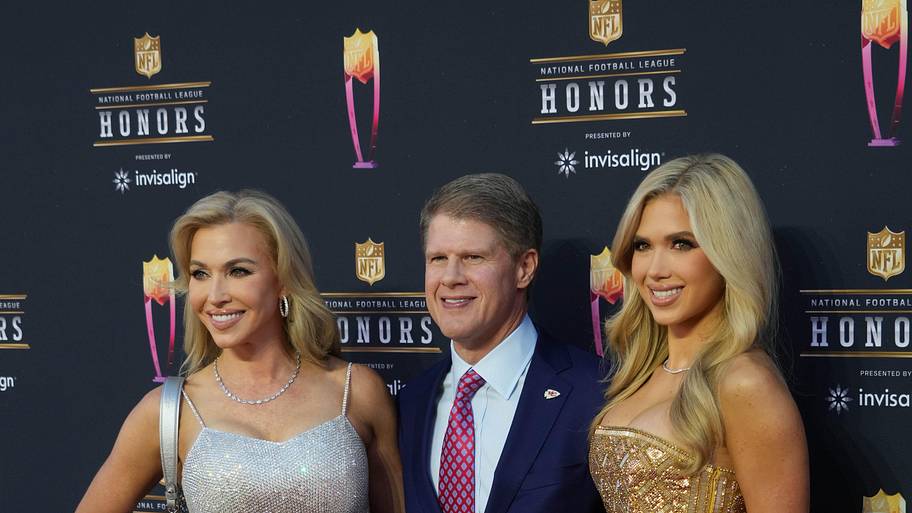 Kansas City Chiefs owner Clark Hunt, with his wife Tavia and daughter Gracie, appears on the red carpet before the NFL Honors
