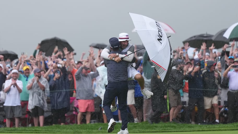 J.J. Spaun and his caddie hug after Spaun's clinching putt at the U.S. Open