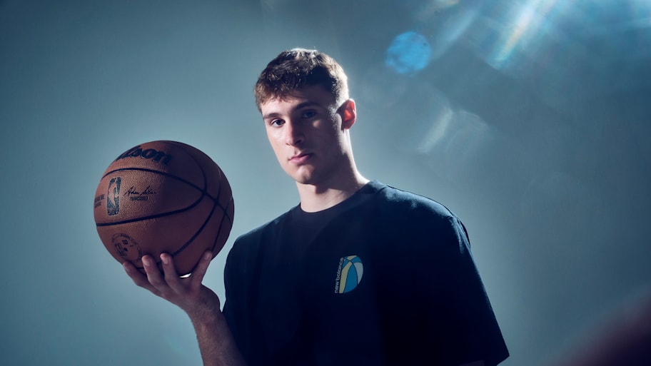 Cooper Flagg poses for a Sports Illustrated portrait with a basketball in his hands.