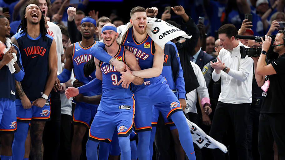 Alex Caruso and Isaiah Hartenstein celebrate during the Thunder's NBA championship victory.