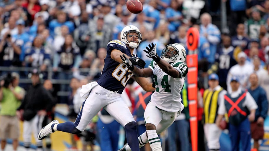 Darrelle Revis covers Vincent Jackson on a pass play with the ball in the air.