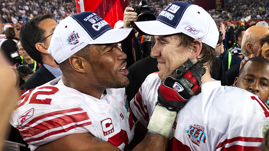 Michael Strahan and Eli Manning celebrate after winning Super Bowl XLII.