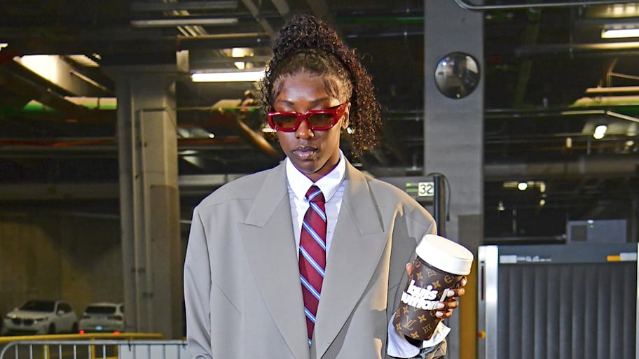 Kahleah Copper arrives for a Mercury game wearing an oversized suit and red sunglasses